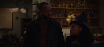 Movie still from “The Curse of Bridge Hollow” (2022), directed by Jeff Wadlow – A man and a woman standing next to each other in a room; Close Up shot, Over the shoulder angle