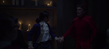 Movie still from “The Curse of Bridge Hollow” (2022), directed by Jeff Wadlow – A man and woman holding hands while standing next to each other; Medium shot, Over the shoulder angle