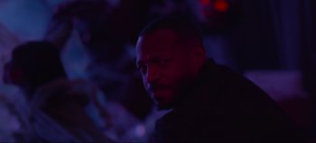 Movie still from “The Curse of Bridge Hollow” (2022), directed by Jeff Wadlow – A person in a dark room; Close Up shot, Over the shoulder angle