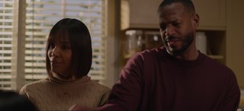 Movie still from “The Curse of Bridge Hollow” (2022), directed by Jeff Wadlow – A man and a woman sitting next to each other in a room; Close Up shot, Over the shoulder angle