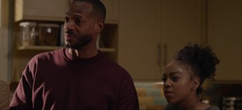 Movie still from “The Curse of Bridge Hollow” (2022), directed by Jeff Wadlow – A man and a woman standing next to each other in a room; Close Up shot, Over the shoulder angle