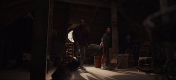 Movie still from “The Curse of Bridge Hollow” (2022), directed by Jeff Wadlow – Two people in a room with a skateboard; Wide shot, Low angle