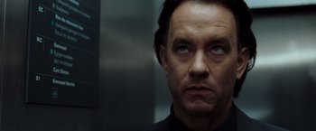 Movie still from “The Da Vinci Code” (2006), directed by Ron Howard – A person looking at the camera; Close Up shot, Low angle