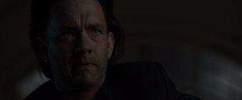 Movie still from “The Da Vinci Code” (2006), directed by Ron Howard – A person with long black hair; Close Up shot, Low angle