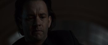 Movie still from “The Da Vinci Code” (2006), directed by Ron Howard – A person with long black hair; Close Up shot, Low angle