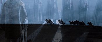 Movie still from “The Da Vinci Code” (2006), directed by Ron Howard – A group of people dressed in medieval garb; Extreme Wide shot, High angle