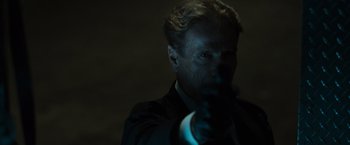 Movie still from “The Da Vinci Code” (2006), directed by Ron Howard – A man in a black suit is pointing at the camera; Close Up shot, Over the shoulder angle