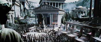 Movie still from “The Da Vinci Code” (2006), directed by Ron Howard – An image of an ancient greek temple with a crowd of people; Extreme Wide shot, High angle