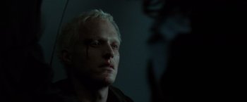 Movie still from “The Da Vinci Code” (2006), directed by Ron Howard – A person with blood on his face; Close Up shot, Over the shoulder angle