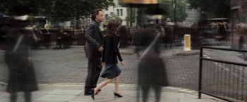 Movie still from “The Da Vinci Code” (2006), directed by Ron Howard – A man and a woman walking down a street; Wide shot, Over the shoulder angle