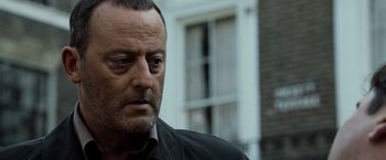 Movie still from “The Da Vinci Code” (2006), directed by Ron Howard – A person wearing a black shirt; Close Up shot, Over the shoulder angle