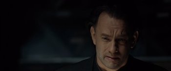 Movie still from “The Da Vinci Code” (2006), directed by Ron Howard – A person wearing a suit; Close Up shot, Over the shoulder angle