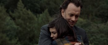 Movie still from “The Da Vinci Code” (2006), directed by Ron Howard – A man and a woman hugging each other outside; Close Up shot, Over the shoulder angle