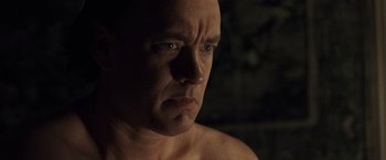 Movie still from “The Da Vinci Code” (2006), directed by Ron Howard – A man's face in the dark; Close Up shot, Over the shoulder angle