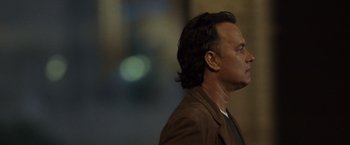 Movie still from “The Da Vinci Code” (2006), directed by Ron Howard – A person with long hair; Close Up shot, Over the shoulder angle