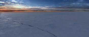Movie still from “The Day After Tomorrow” (2004), directed by Roland Emmerich – An image of an ocean that is covered in snow; Extreme Wide shot, High angle