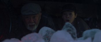 Movie still from “The Day After Tomorrow” (2004), directed by Roland Emmerich – A man and a woman looking out of a car window at night; Close Up shot, Low angle