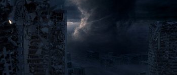 Movie still from “The Day After Tomorrow” (2004), directed by Roland Emmerich – A dark sky over a city filled with buildings; Extreme Wide shot, High angle