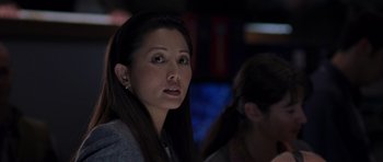 Movie still from “The Day After Tomorrow” (2004), directed by Roland Emmerich – A person with long dark hair; Close Up shot, Over the shoulder angle