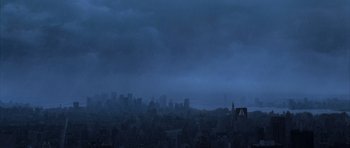 Movie still from “The Day After Tomorrow” (2004), directed by Roland Emmerich – A city skyline with dark clouds in the background; Extreme Wide shot, Overhead angle