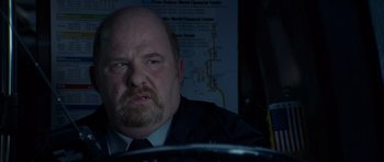 Movie still from “The Day After Tomorrow” (2004), directed by Roland Emmerich – A person sitting in a car; Close Up shot, Over the shoulder angle