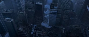 Movie still from “The Day After Tomorrow” (2004), directed by Roland Emmerich – An aerial view of a city with a large wave crashing on it; Extreme Wide shot, Overhead angle