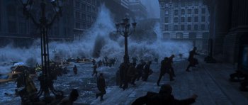 Movie still from “The Day After Tomorrow” (2004), directed by Roland Emmerich – A group of people are running through the water; Extreme Wide shot, High angle