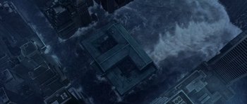 Movie still from “The Day After Tomorrow” (2004), directed by Roland Emmerich – An aerial view of a building in the middle of a city; Extreme Wide shot, Overhead angle