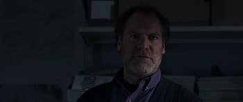 Movie still from “The Day After Tomorrow” (2004), directed by Roland Emmerich – A person wearing a shirt and jacket; Close Up shot, Low angle