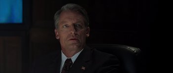 Movie still from “The Day After Tomorrow” (2004), directed by Roland Emmerich – A person wearing a suit and tie; Close Up shot, Low angle