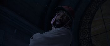 Movie still from “The Day After Tomorrow” (2004), directed by Roland Emmerich – A man wearing a hat and a jacket; Close Up shot, Low angle