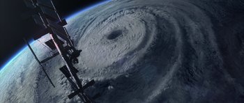Movie still from “The Day After Tomorrow” (2004), directed by Roland Emmerich – A view of a very large storm from space; Extreme Wide shot, Overhead angle