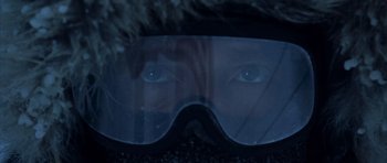 Movie still from “The Day After Tomorrow” (2004), directed by Roland Emmerich – A person wearing a pair of goggles in the dark; Extreme Close Up shot, Over the shoulder angle