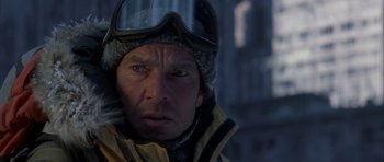 Movie still from “The Day After Tomorrow” (2004), directed by Roland Emmerich – A person wearing a helmet; Close Up shot, Over the shoulder angle