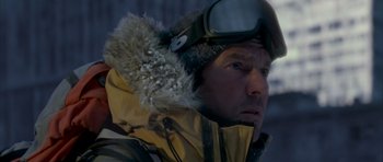 Movie still from “The Day After Tomorrow” (2004), directed by Roland Emmerich – A person wearing goggles and a jacket; Close Up shot, Low angle