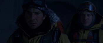 Movie still from “The Day After Tomorrow” (2004), directed by Roland Emmerich – A person wearing a jacket; Close Up shot, Over the shoulder angle