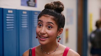 Movie still from “Crush” (2022), directed by Sammi Cohen – A woman with a surprised look on her face; Close Up shot, Over the shoulder angle