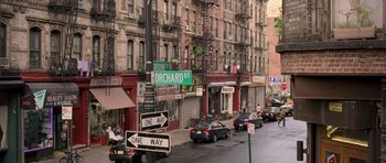 Movie still from “The Devil Wears Prada” (2006), directed by David Frankel – A city street filled with lots of parked cars; Extreme Wide shot, High angle