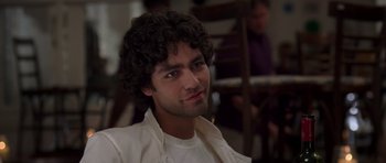 Movie still from “The Devil Wears Prada” (2006), directed by David Frankel – A person wearing a white shirt; Close Up shot, Over the shoulder angle