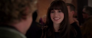 Movie still from “The Devil Wears Prada” (2006), directed by David Frankel – A person with long black hair; Close Up shot, Over the shoulder angle