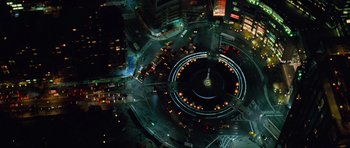 Movie still from “The Devil Wears Prada” (2006), directed by David Frankel – An aerial view of a busy city at night time; Extreme Wide shot, Overhead angle