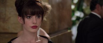 Movie still from “The Devil Wears Prada” (2006), directed by David Frankel – A person wearing a black shirt; Close Up shot, Over the shoulder angle