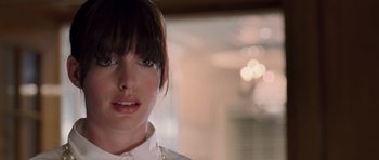 Movie still from “The Devil Wears Prada” (2006), directed by David Frankel – A person wearing a white shirt; Close Up shot, Over the shoulder angle