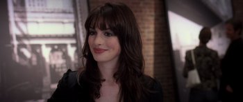 Movie still from “The Devil Wears Prada” (2006), directed by David Frankel – A person with long brown hair; Close Up shot, Over the shoulder angle