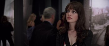 Movie still from “The Devil Wears Prada” (2006), directed by David Frankel – A person wearing a suit and tie; Close Up shot, Over the shoulder angle