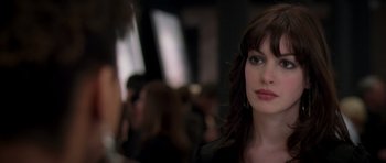 Movie still from “The Devil Wears Prada” (2006), directed by David Frankel – A person with long brown hair; Close Up shot, Over the shoulder angle