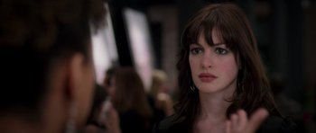 Movie still from “The Devil Wears Prada” (2006), directed by David Frankel – A person with long hair; Close Up shot, Over the shoulder angle
