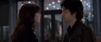 Movie still from “The Devil Wears Prada” (2006), directed by David Frankel – A man and a woman looking at one another; Close Up shot, Over the shoulder angle