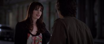 Movie still from “The Devil Wears Prada” (2006), directed by David Frankel – A woman talking to a young man in a dark room; Close Up shot, Over the shoulder angle