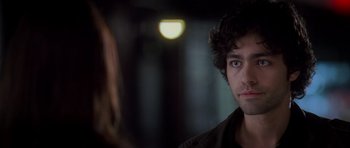 Movie still from “The Devil Wears Prada” (2006), directed by David Frankel – A person looking at the camera; Close Up shot, Over the shoulder angle